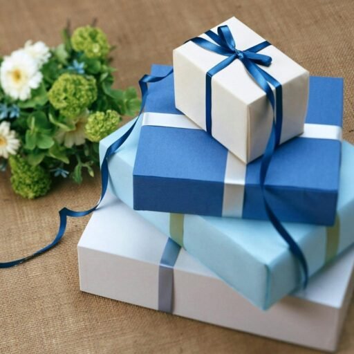 Three beautifully wrapped gift boxes with blue ribbons arranged beside a floral bouquet.